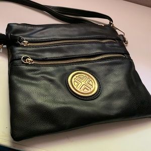 Black shoulder bag with lots of compartments